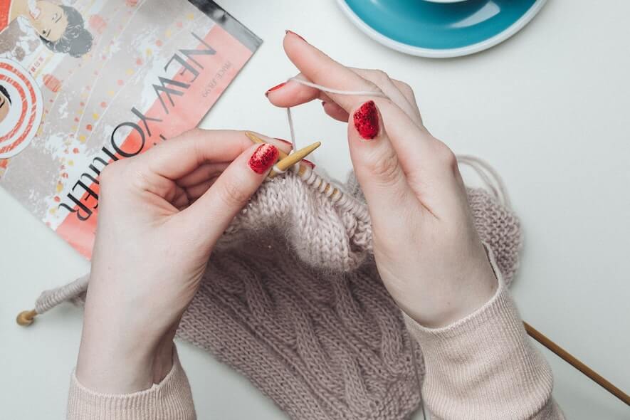 Mindful activities like knitting is a fantastic way to practice self-care during your period